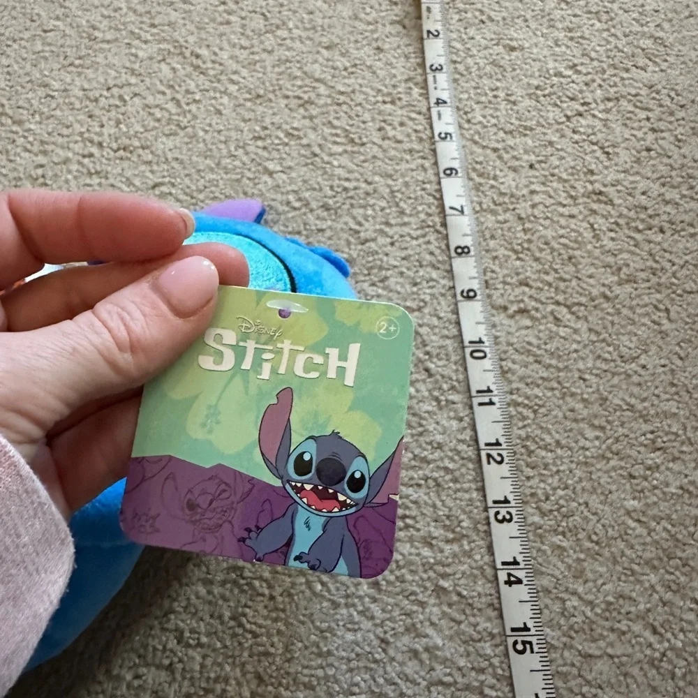 Stitch holding a coffee